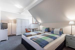 Кровать или кровати в номере Penzion Bavaria