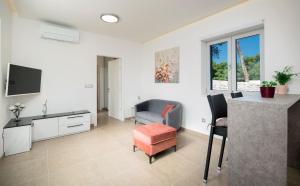 TV a/nebo společenská místnost v ubytování Beach Residences Caroline