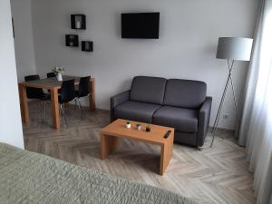Posezení v ubytování Gray House Apartmán + 8 fotografií