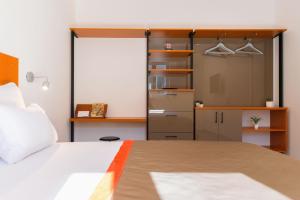 Postel nebo postele na pokoji v ubytování Beach Residences Caroline