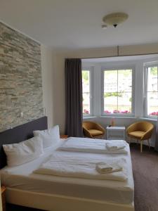 Postel nebo postele na pokoji v ubytování Haus Burgfrieden Cochem + 16 fotografií
