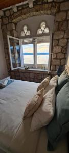 A bed or beds in a room at Beach front AmF Holiday Home