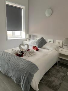 Кровать или кровати в номере Guest House Triunfo