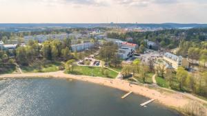 an aerial view of a city with a beach and buildings at Pinjakoti in Lahti