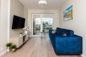 Telewizja i/lub zestaw kina domowego w obiekcie HollyŁódź Apartment NETFLIX