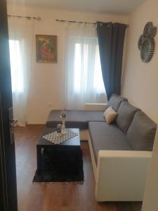 a living room with a couch and a table at MINT APARTMENTS in Zadar