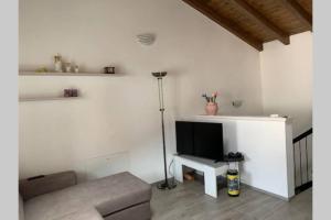 TV a/nebo společenská místnost v ubytování Casetta al Portico, relax e tranquillità