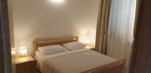 Postel nebo postele na pokoji v ubytování Apartments Cocaletto5