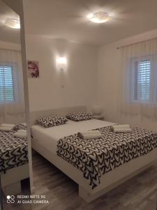 Postel nebo postele na pokoji v ubytování Apartman Šuperba A2