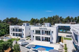 an aerial view of a building with a swimming pool at 1oak rentals 2 in Vir