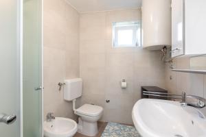 Koupelna v ubytování Apartmani "RUŽA"