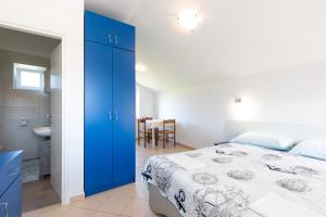 Postel nebo postele na pokoji v ubytování Apartmani "RUŽA"