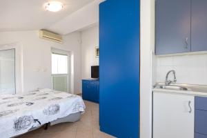 Postel nebo postele na pokoji v ubytování Apartmani "RUŽA"