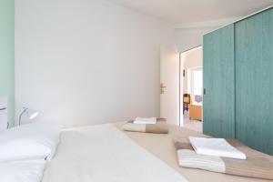 Postel nebo postele na pokoji v ubytování Apartmani "RUŽA"