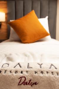 Un ou plusieurs lits dans un hébergement de l'établissement Dalya Resort Aqua & Spa Hotel Datça