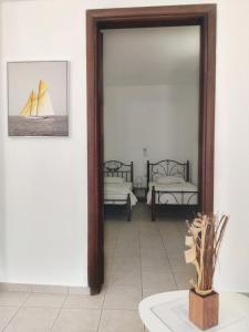 Gompos Apartment - Cozy Apartment next to the sea - Amazing Sea View客房内的一张或多张床位