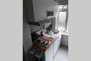 Kuchyň nebo kuchyňský kout v ubytování Zomerhuis Strand 28 + 3 fotografie