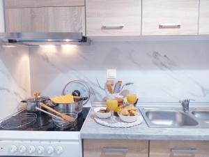 A kitchen or kitchenette at Angelina's cosy apartment in Corfu town