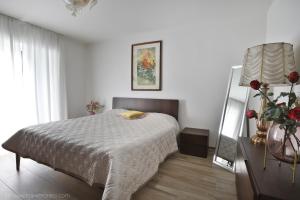 Кровать или кровати в номере Appartamenti Ramarro