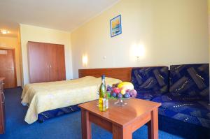 Postel nebo postele na pokoji v ubytování Family Hotel Eliri