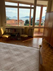 a living room with a large window with a view at La Casa di Loris in Lerici
