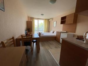 A bed or beds in a room at Apartments in Panorama Beach Vigo Nessebar