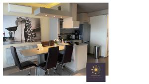 Kuchyňa alebo kuchynka v ubytovaní Rising Sun Panorama Apartman I