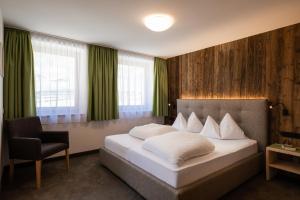 מיטה או מיטות בחדר ב-Hotel & Residence Rebhof