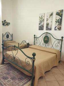 Giường trong phòng chung tại La Rosa del Sud