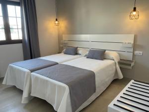 Katil atau katil-katil dalam bilik di Apartamentos Fayna