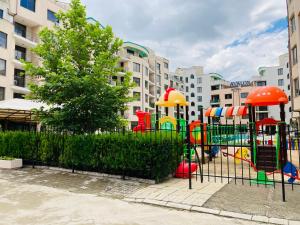 a playground in front of a apartment complex at Good Vibes apartment Avalon in Sunny Beach