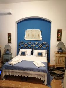 Säng eller sängar i ett rum på Il Trullo del Cadetto