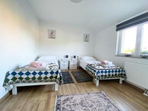 Posteľ alebo postele v izbe v ubytovaní Apartmani Fenestra -Zagorka