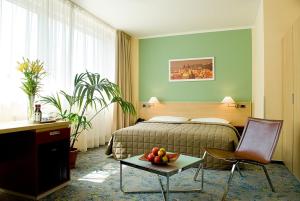 Postel nebo postele na pokoji v ubytování Hotel Michael