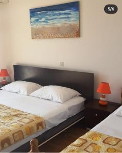 A bed or beds in a room at Apartmani Alfijo