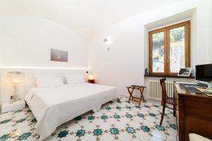 Posteľ alebo postele v izbe v ubytovaní Amalfi Coast Family Luxury Suite