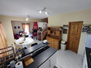 a kitchen and a living room with a counter top at Good Vibes Villa in Eresos