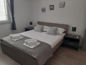 Postel nebo postele na pokoji v ubytování Apartman Alberta