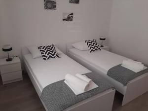 Postel nebo postele na pokoji v ubytování Apartman Alberta
