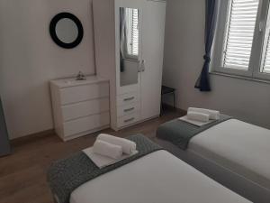 Postel nebo postele na pokoji v ubytování Apartman Alberta