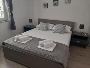 Postel nebo postele na pokoji v ubytování Apartman Alberta