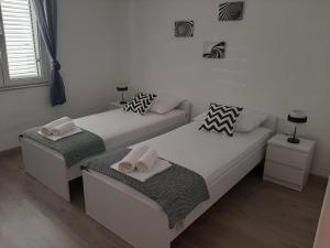 Postel nebo postele na pokoji v ubytování Apartman Alberta