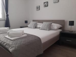 Postel nebo postele na pokoji v ubytování Apartman Alberta