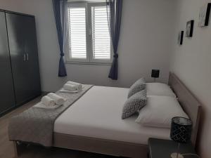 Postel nebo postele na pokoji v ubytování Apartman Alberta
