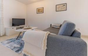 TV a/nebo společenská místnost v ubytování Apartman Leon