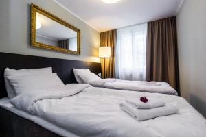 Postel nebo postele na pokoji v ubytování Hotel Marino