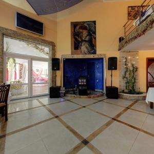 a living room with a large screen tv in a room at Morshynska Vezha Hotel in Morshin