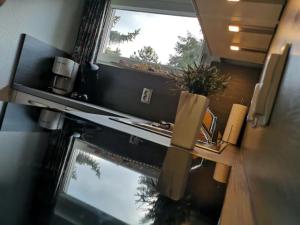 a view of a kitchen with a window and a stove at Maja am See in Biersdorf am See