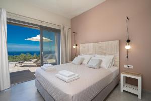 Ένα ή περισσότερα κρεβάτια σε δωμάτιο στο villa Calma +66 φωτογραφίες