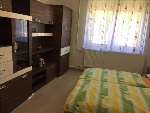 A bed or beds in a room at House and Apartment Balatonmariafürdo 19319